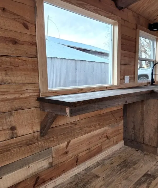 Window and bar counter along a log wall