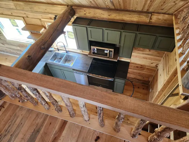 Bath and storage area in a solid-log cabin