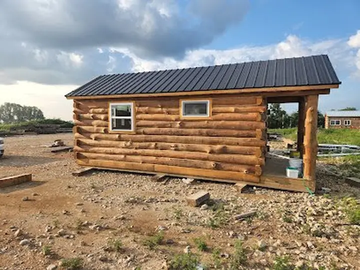 Exterior with porch — Timberstone solid-log cabin