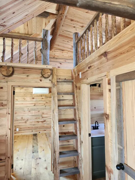 Log ladder to loft — Timberstone solid-log cabin